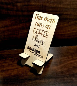 This mom runs on Coffee Chaos and Amazon Prime Phone Stand